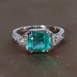 2.71 Carat Zambian Emerald and Diamond Three-Stone Ring in 18K White Gold